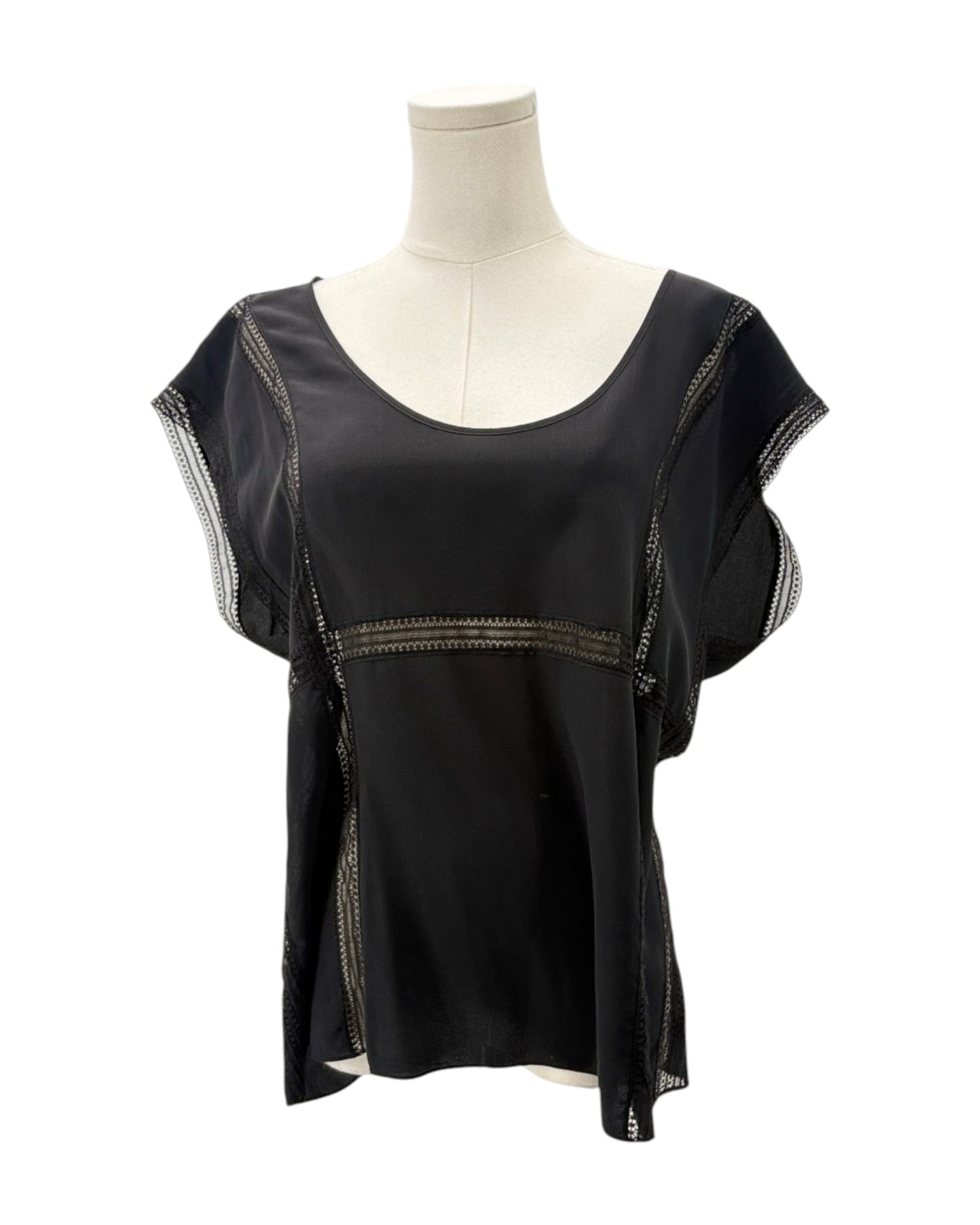 Black top with sheer sleeves on a mannequin against a white background