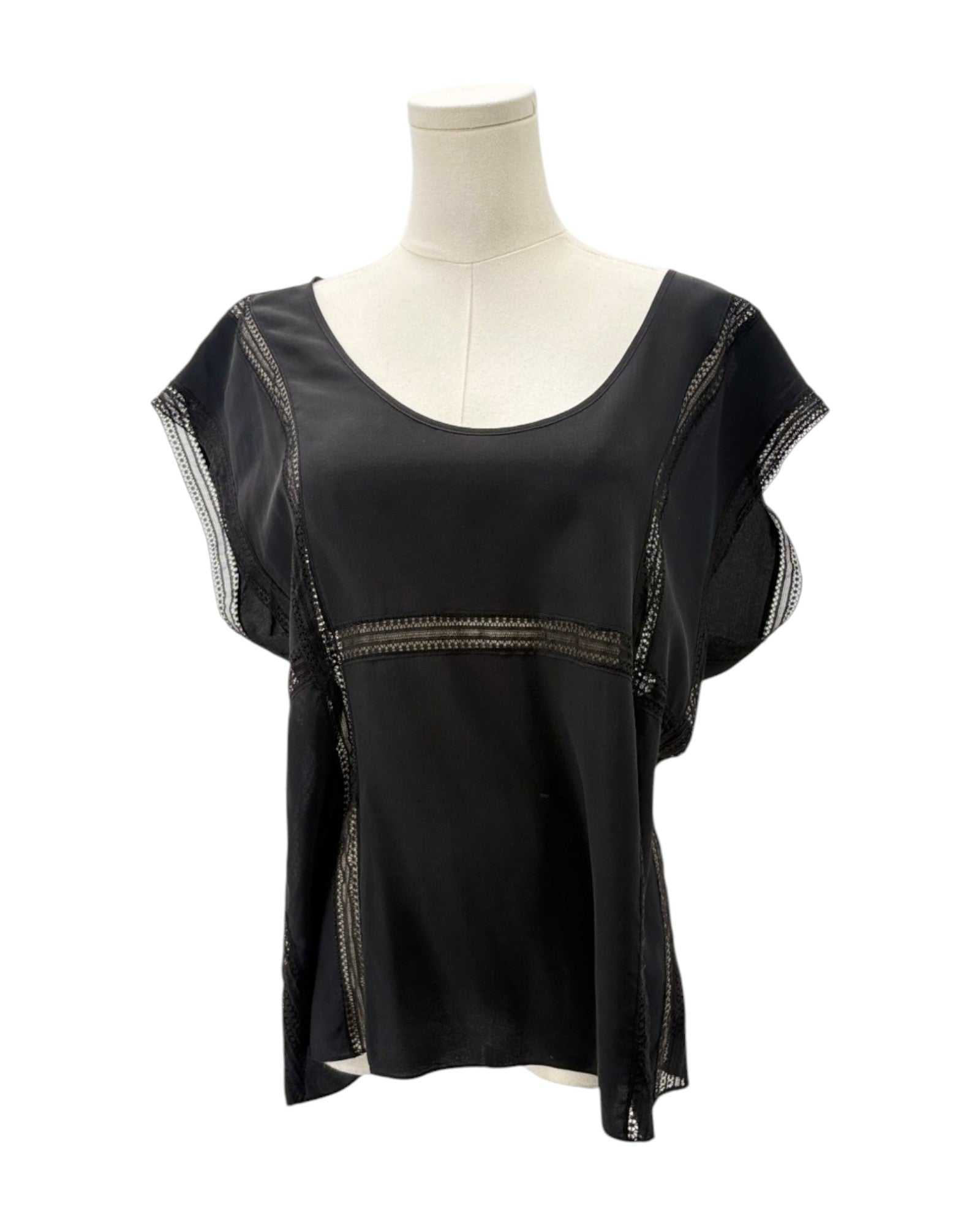 Black top with sheer sleeves on a mannequin against a white background