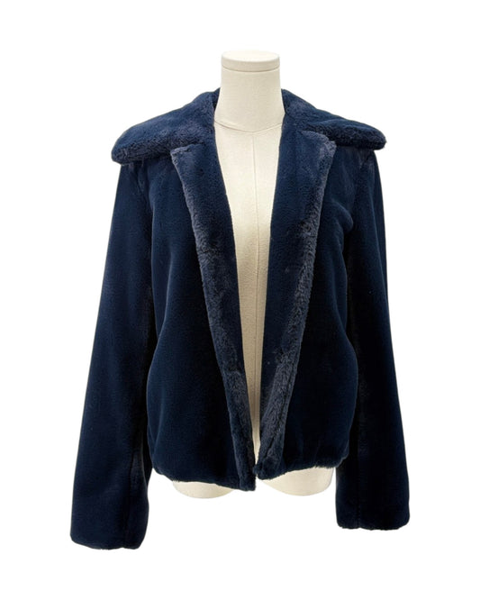 Navy blue coat with fur trim on a mannequin against a white background
