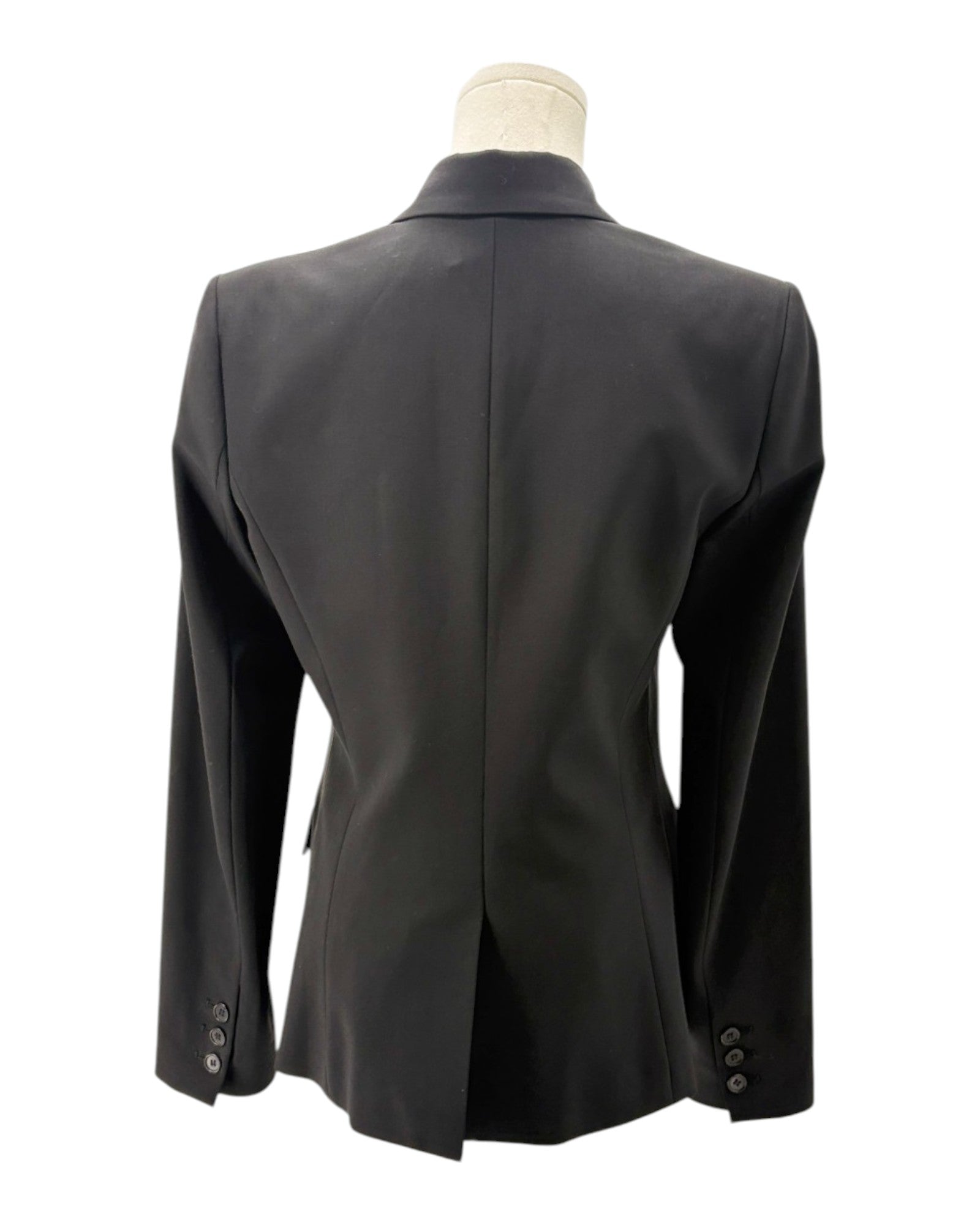 Black blazer on a mannequin against a white background