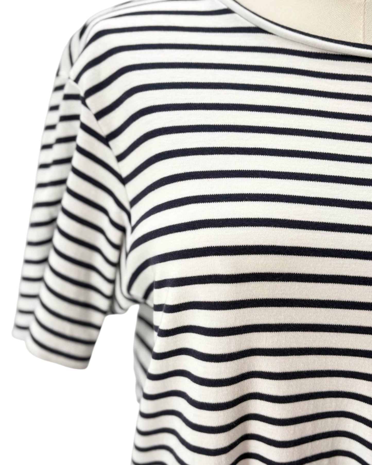 Navy and white striped dress on a mannequin against a white background