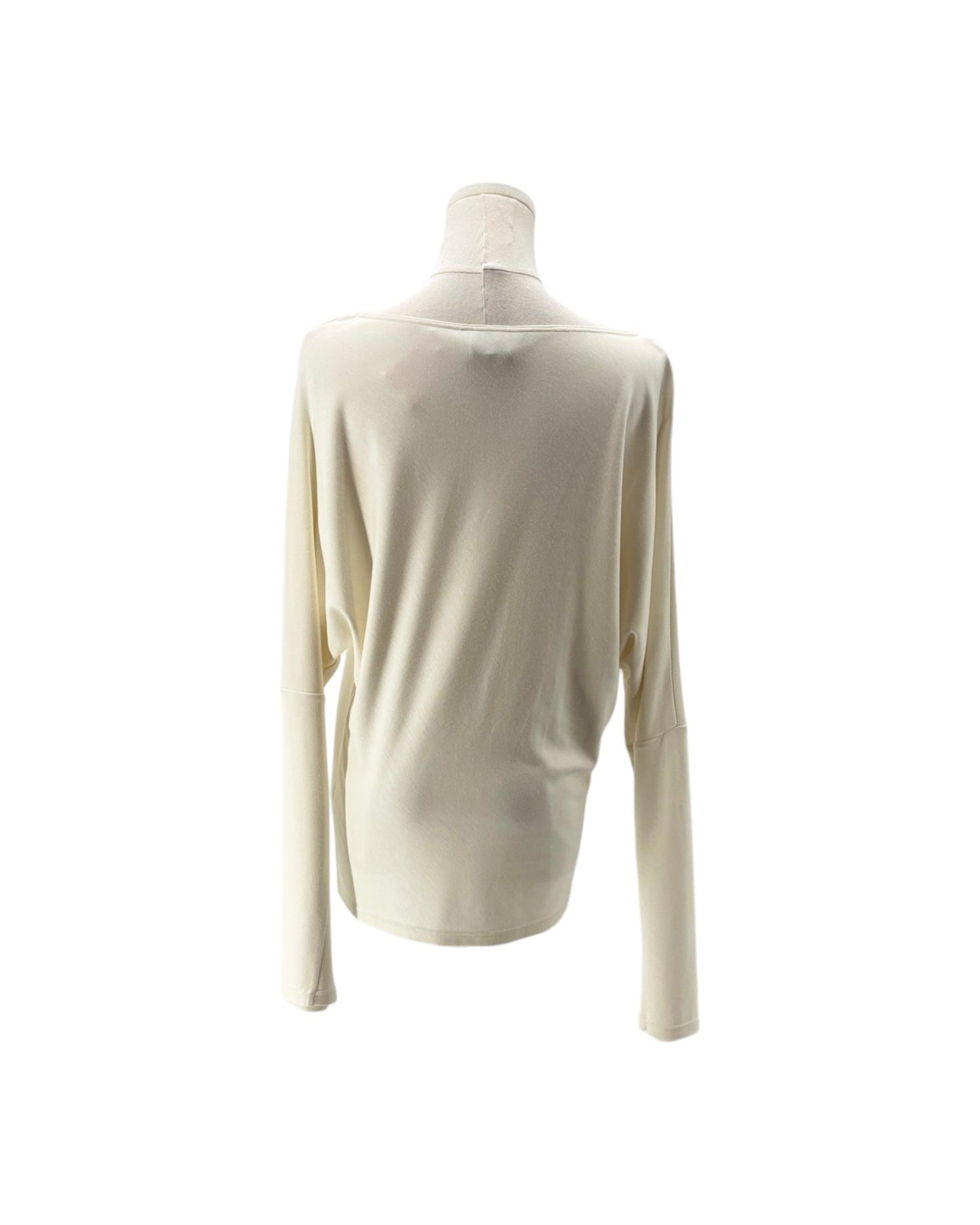 A cream-colored long-sleeve knit top displayed on a mannequin torso against a plain white background.