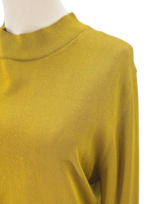 Yellow sweater on a mannequin with a white background