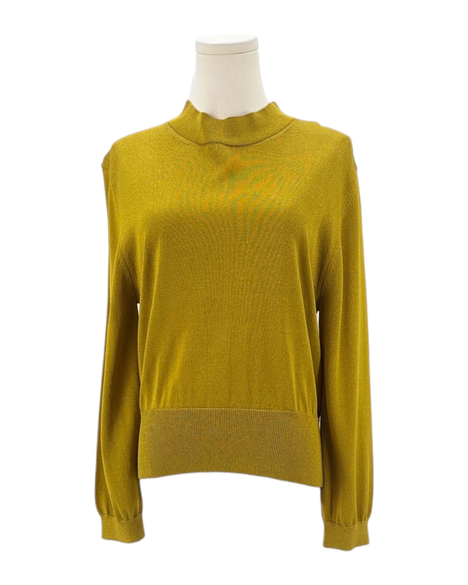 Yellow sweater on a mannequin against a white background