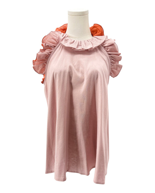 Pink top with ruffled sleeves on a mannequin against a white background