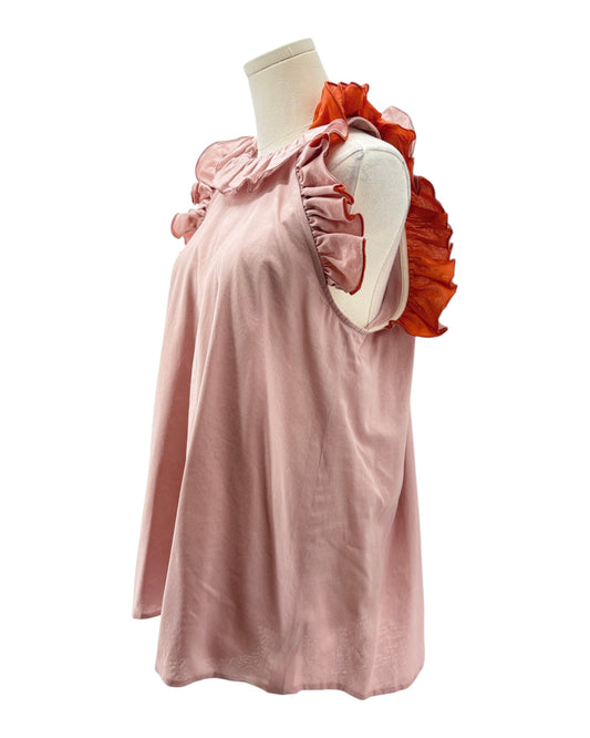 Pink top with ruffled sleeves on a mannequin against a white background