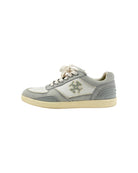 Gray tennis shoes on white background