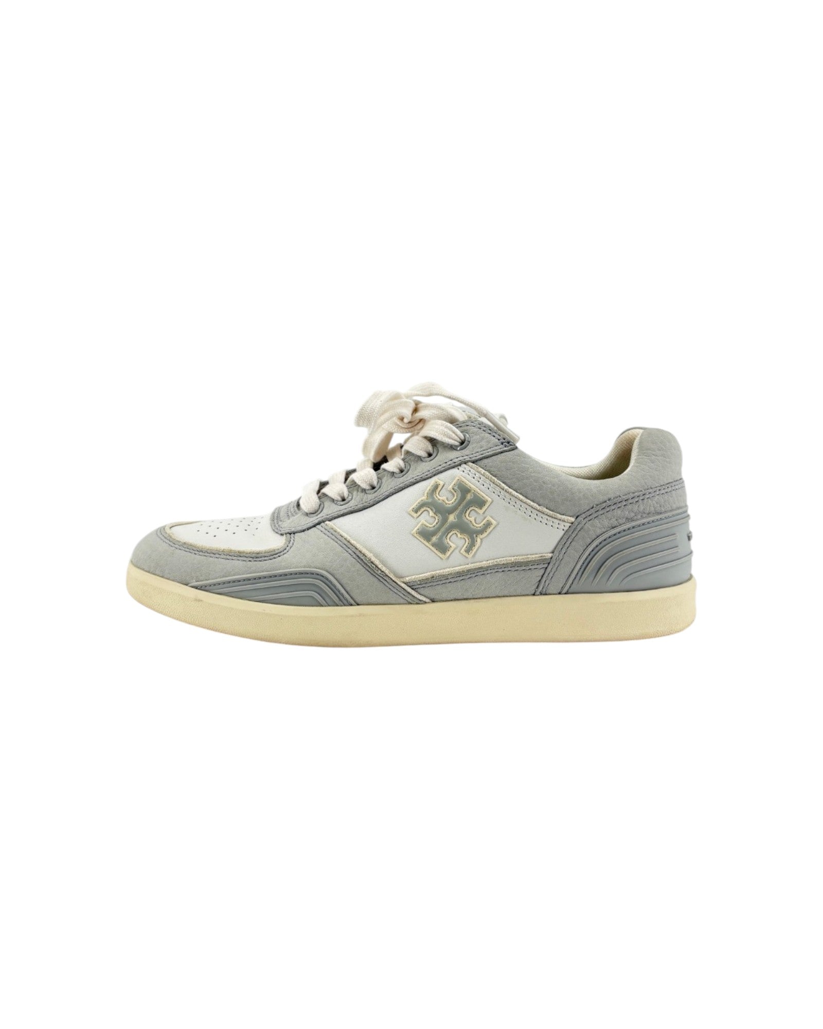 Gray tennis shoes on white background