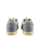 Gray sneakers with white soles on a white background