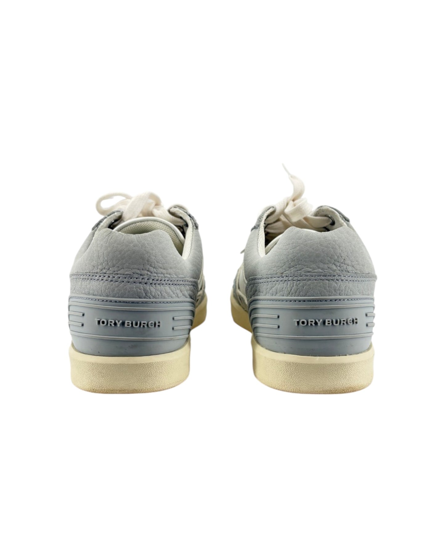 Gray sneakers with white soles on a white background