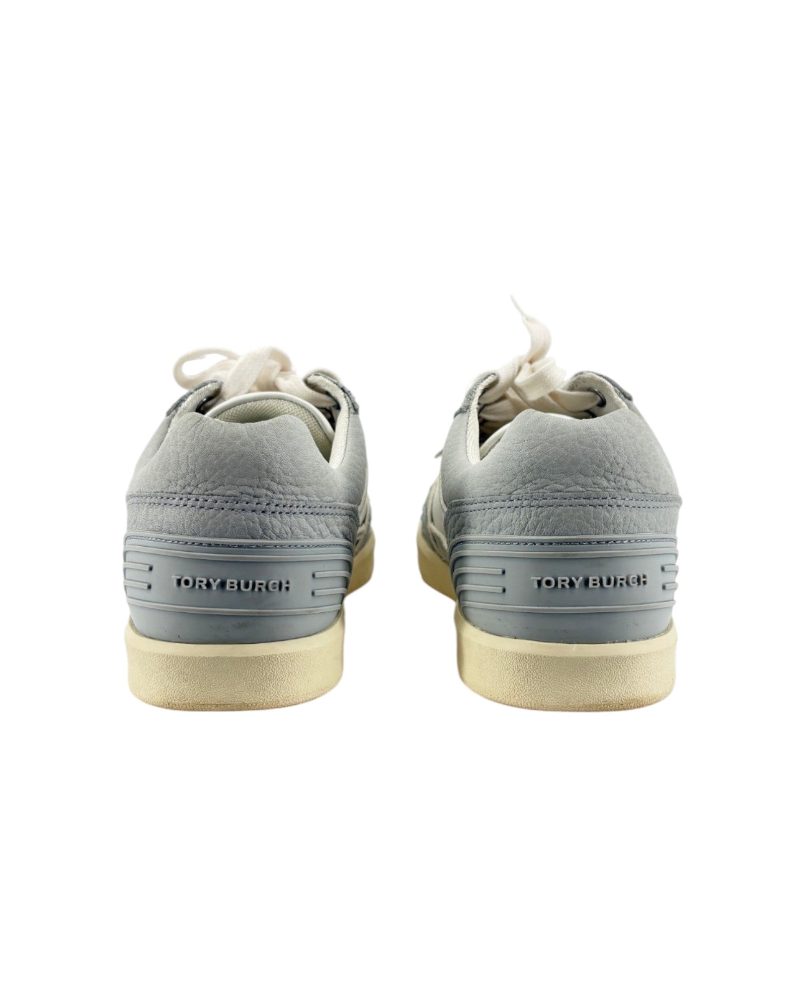 Gray sneakers with white soles on a white background