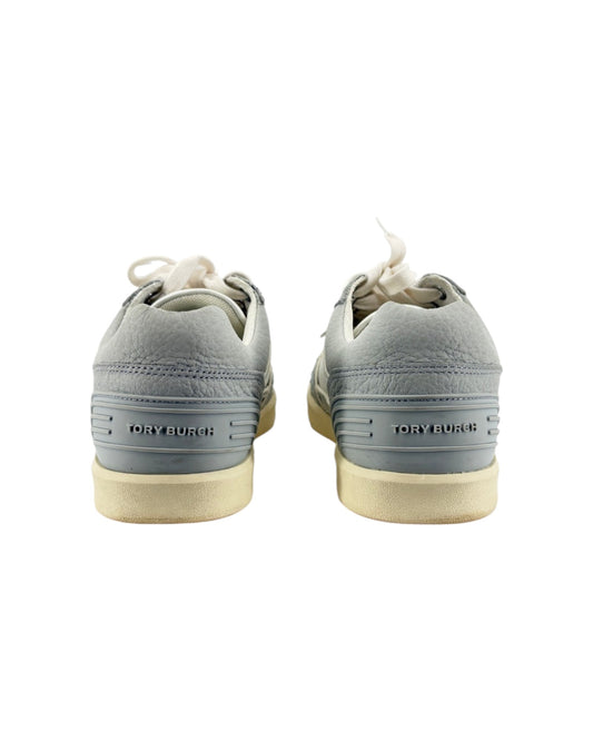 Gray sneakers with white soles on a white background