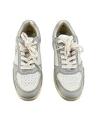 Pair of gray and white sneakers on a white background