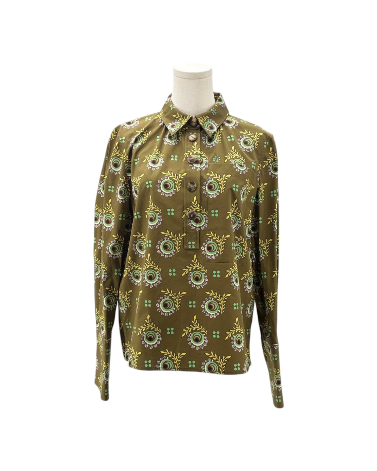 A long-sleeve button-up shirt with an all-over circular floral pattern in olive green, yellow, and white, displayed on a mannequin torso against a plain white background.