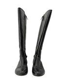 Pair of black knee-high boots on a white background