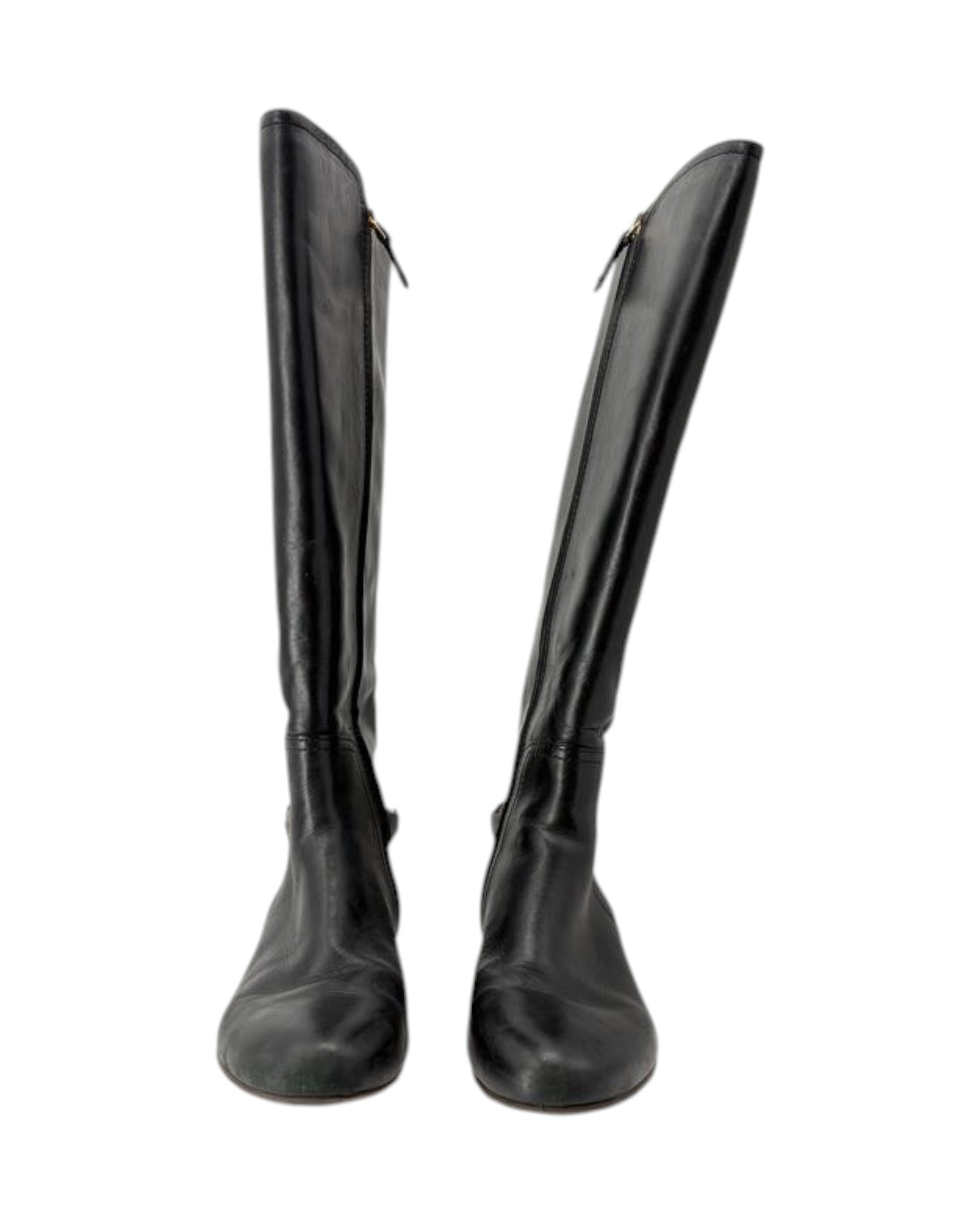 Pair of black knee-high boots on a white background