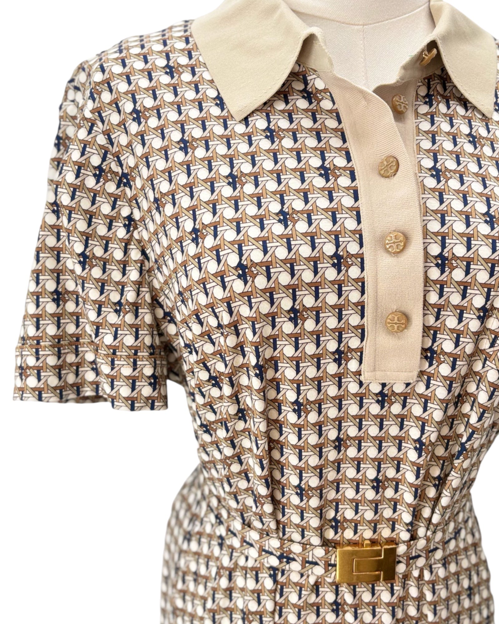 Short-sleeve shirt with a patterned design on a mannequin against a white background