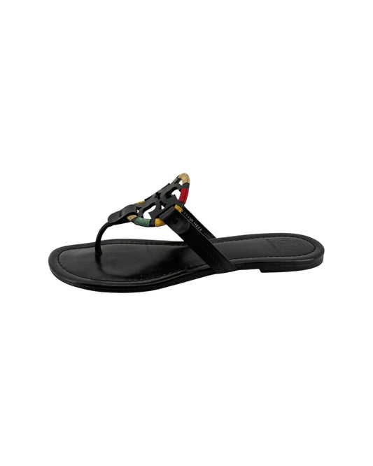 Black sandal with colorful straps on a white background