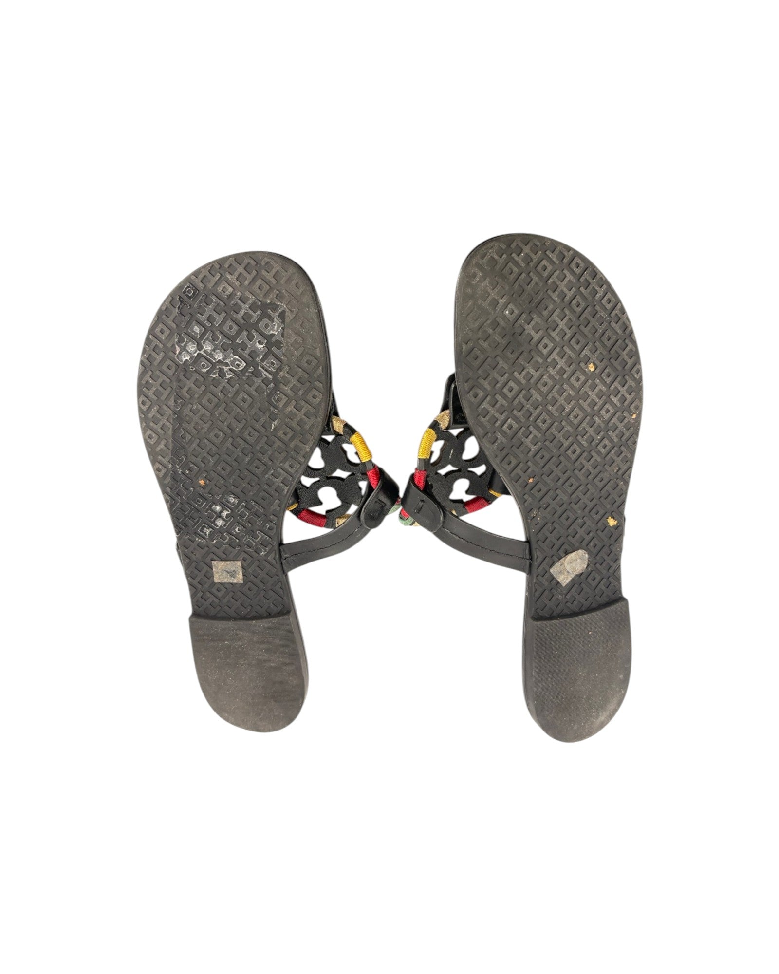 Pair of gray sandals with colorful accents on a white background