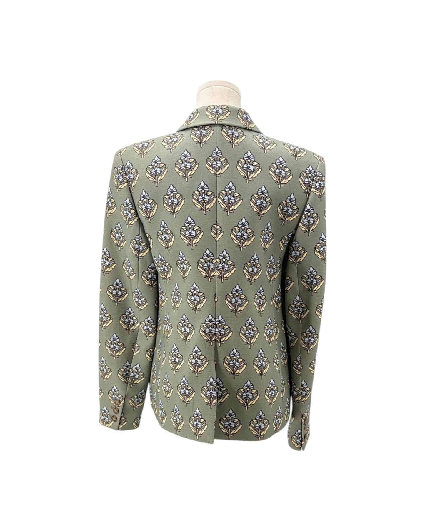 An olive green men's blazer jacket with a detailed geometric and floral pattern in blue, gold, and white, displayed on a white mannequin torso against a plain white background.