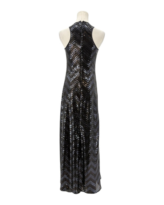 Black sequin evening gown on a mannequin against a white background