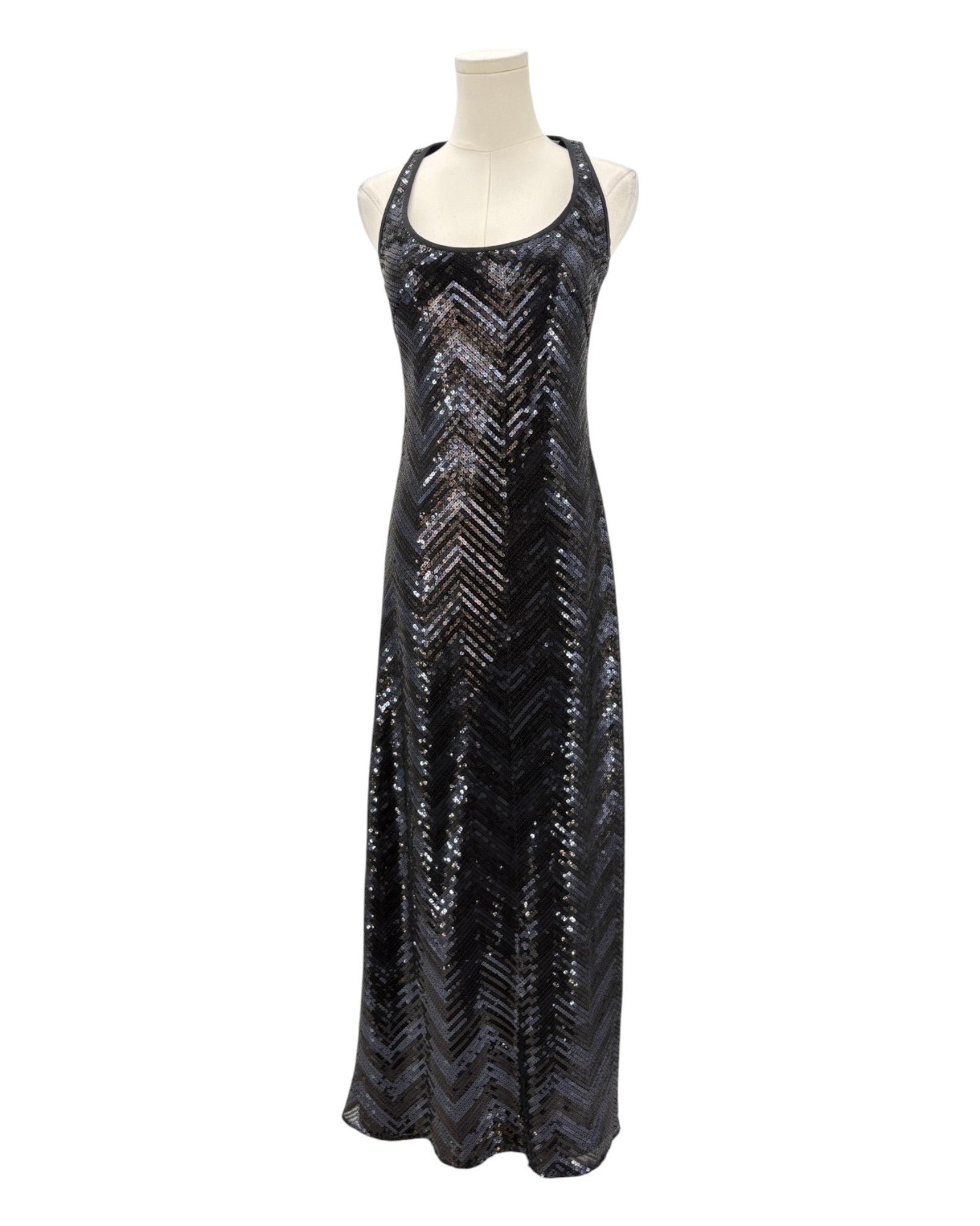 Black sequin dress on a mannequin against a white background