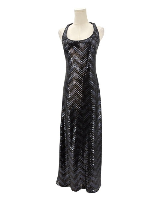 Black sequin dress on a mannequin against a white background