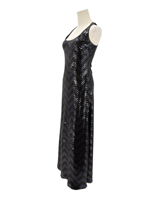 Black sequin dress on a mannequin against a white background