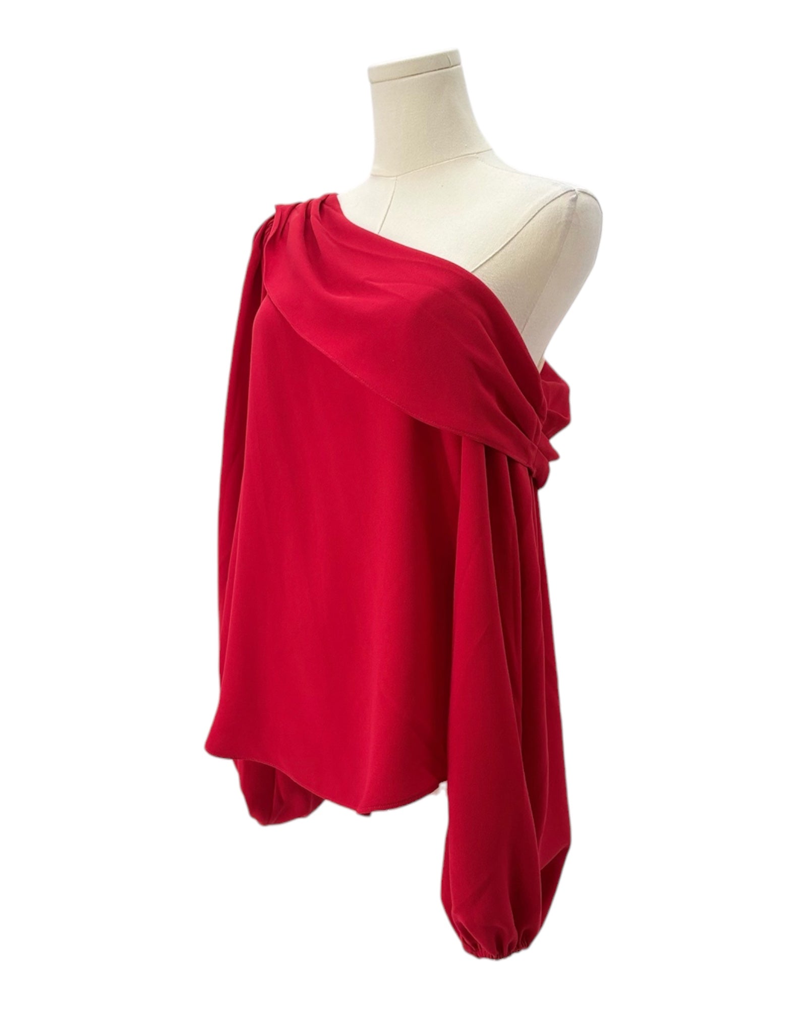 Red one-shoulder top on a mannequin against a white background