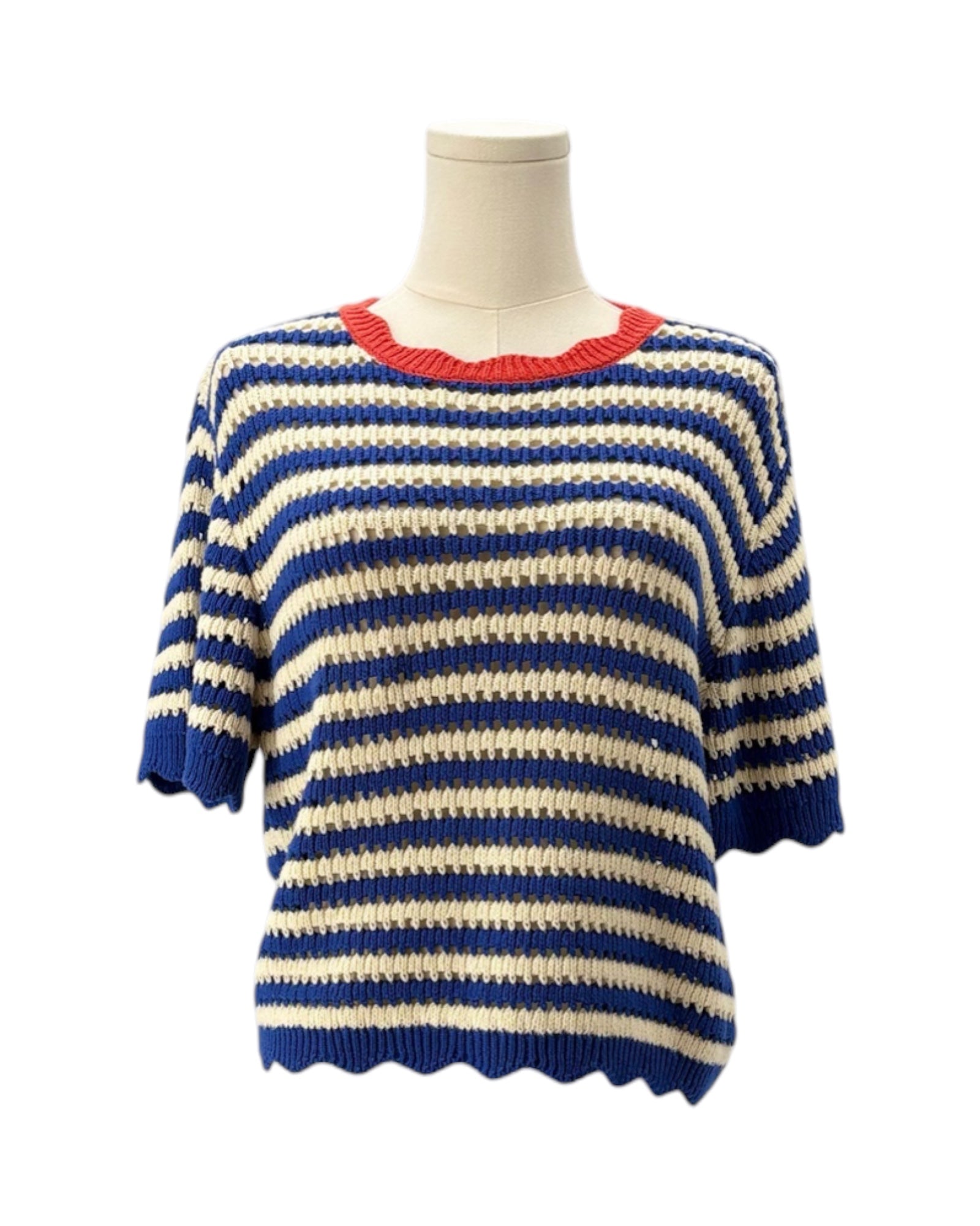 Blue and white striped sweater on a mannequin with a red trim against a white background