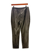 Black leather pants on a hanger against a white background