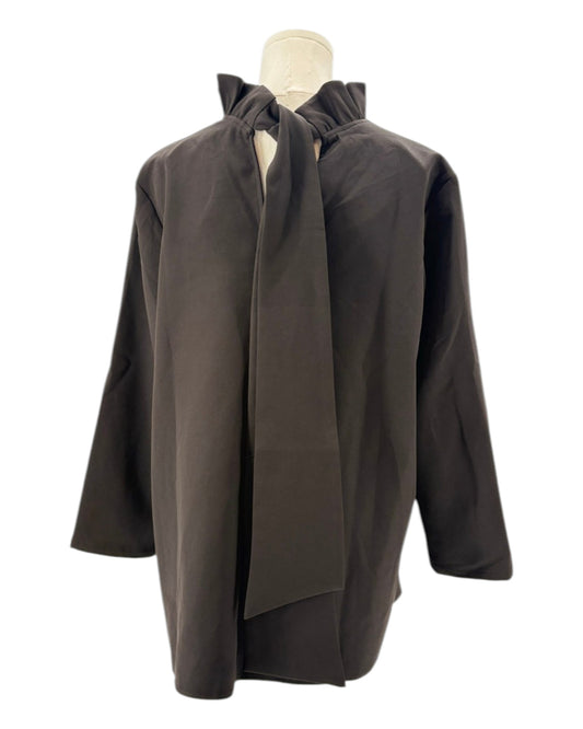 Tuckernuck black blouse with ruffle collar and a bow neckline on a mannequin against a white background