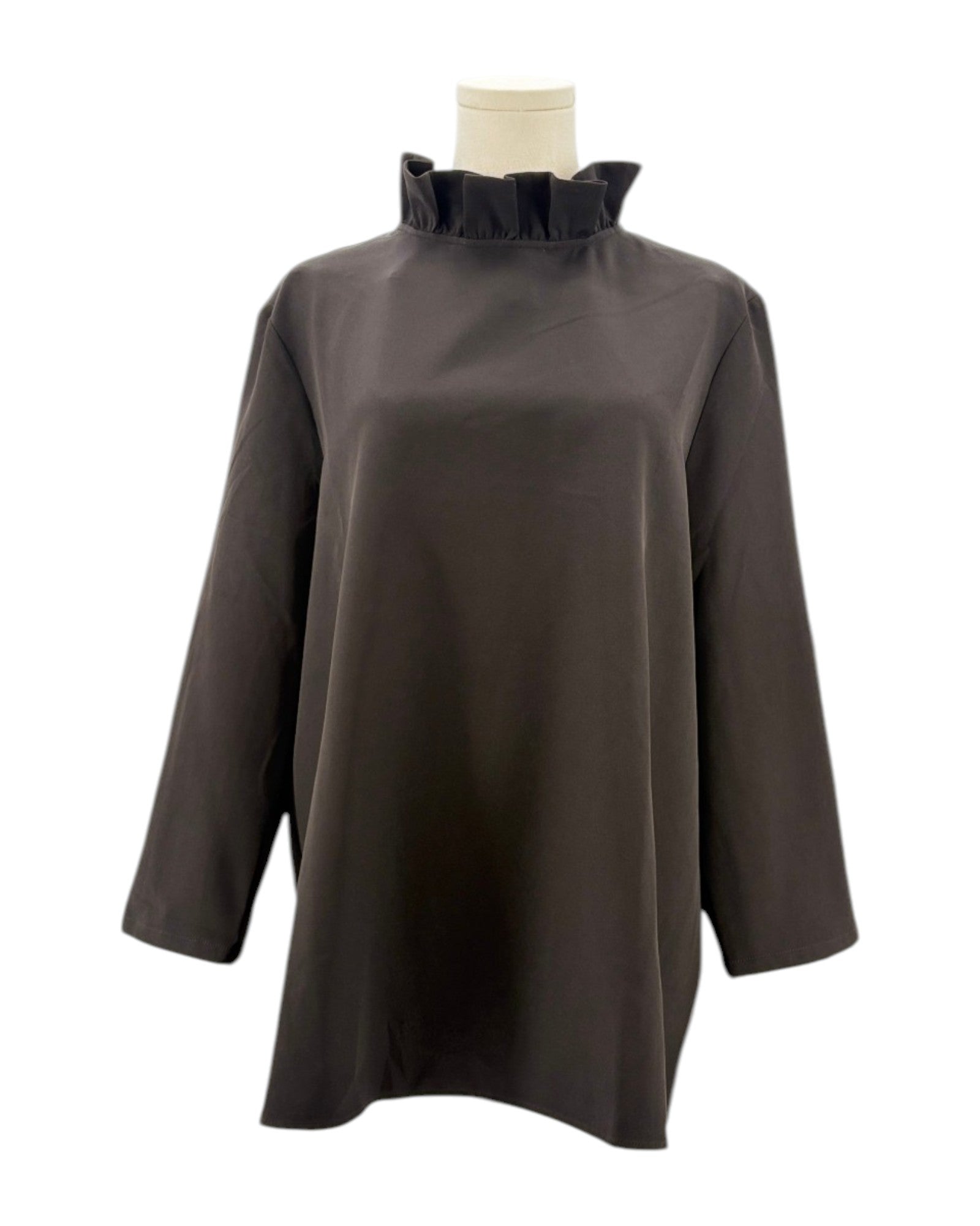 Tuckernuck black blouse with ruffle collar and a bow neckline on a mannequin against a white background