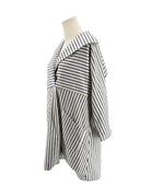 Striped mini dress on mannequin on a white background