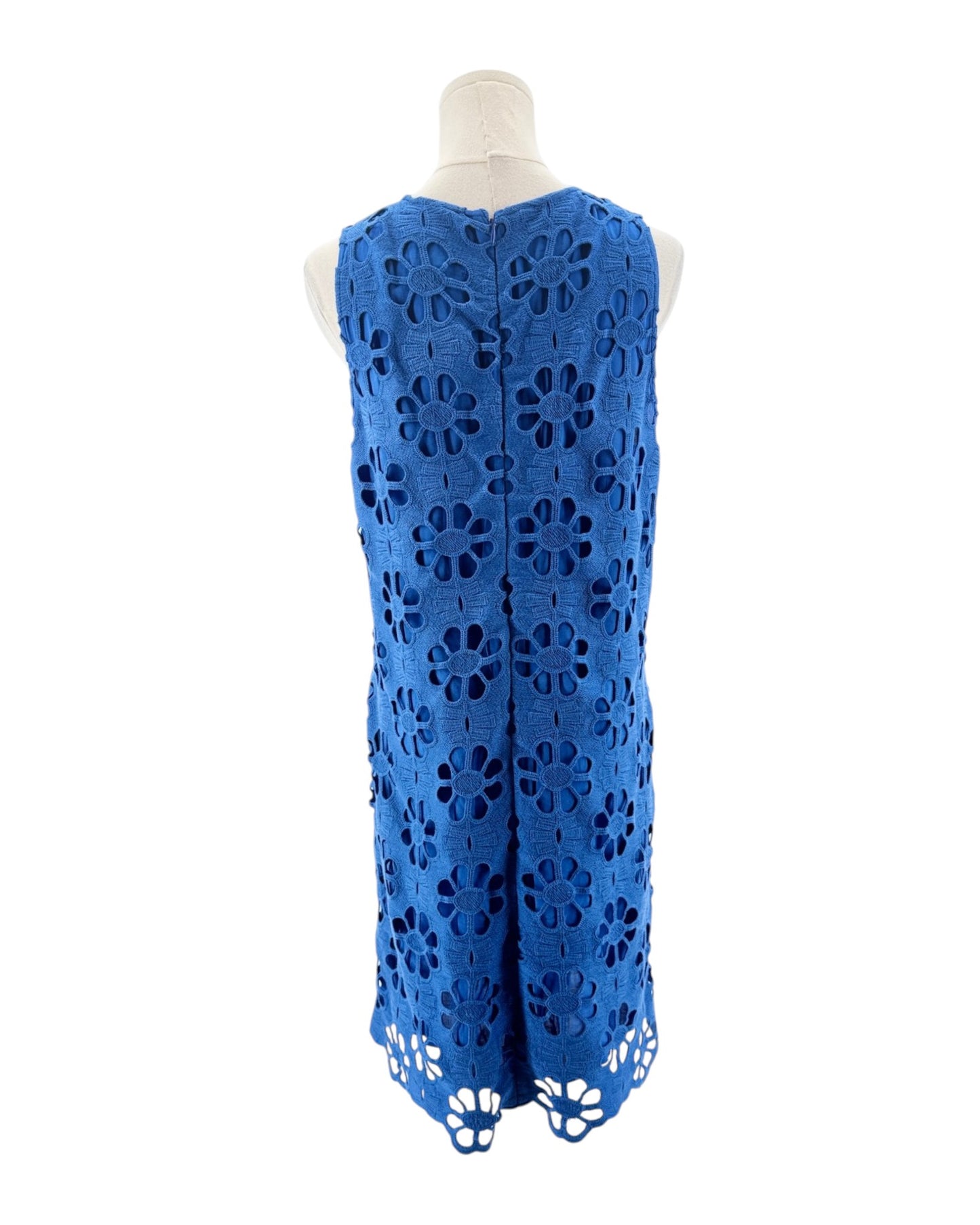 Blue lace dress on a mannequin against a white background