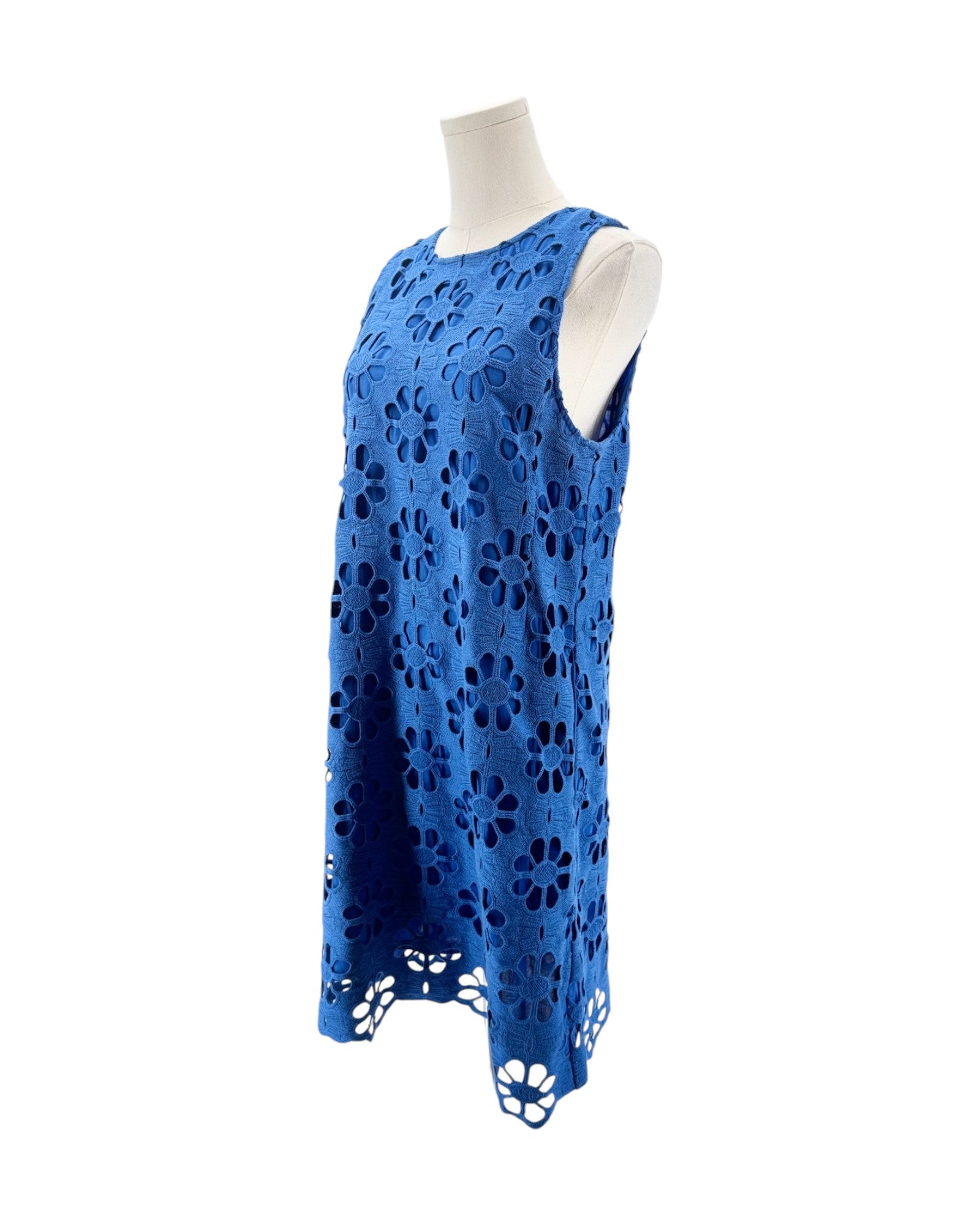 Blue sleeveless dress with lace detailing on a mannequin against a white background