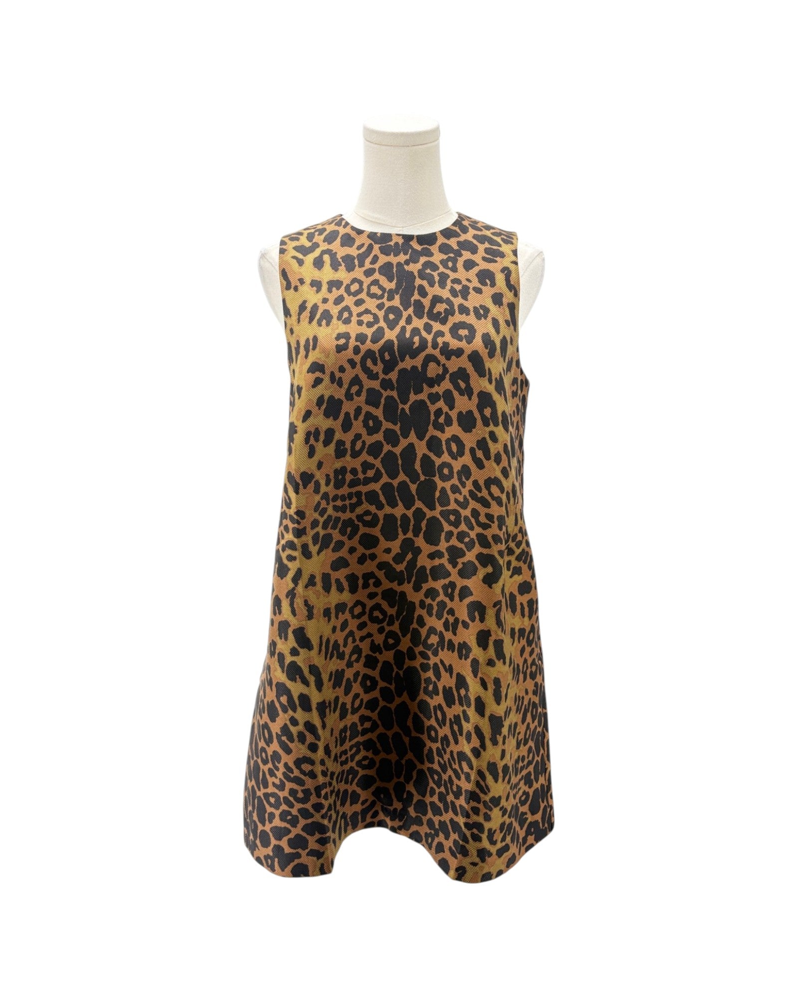 A sleeveless A-line dress with a leopard print pattern in brown, black, and tan, displayed on a white mannequin torso against a white background.