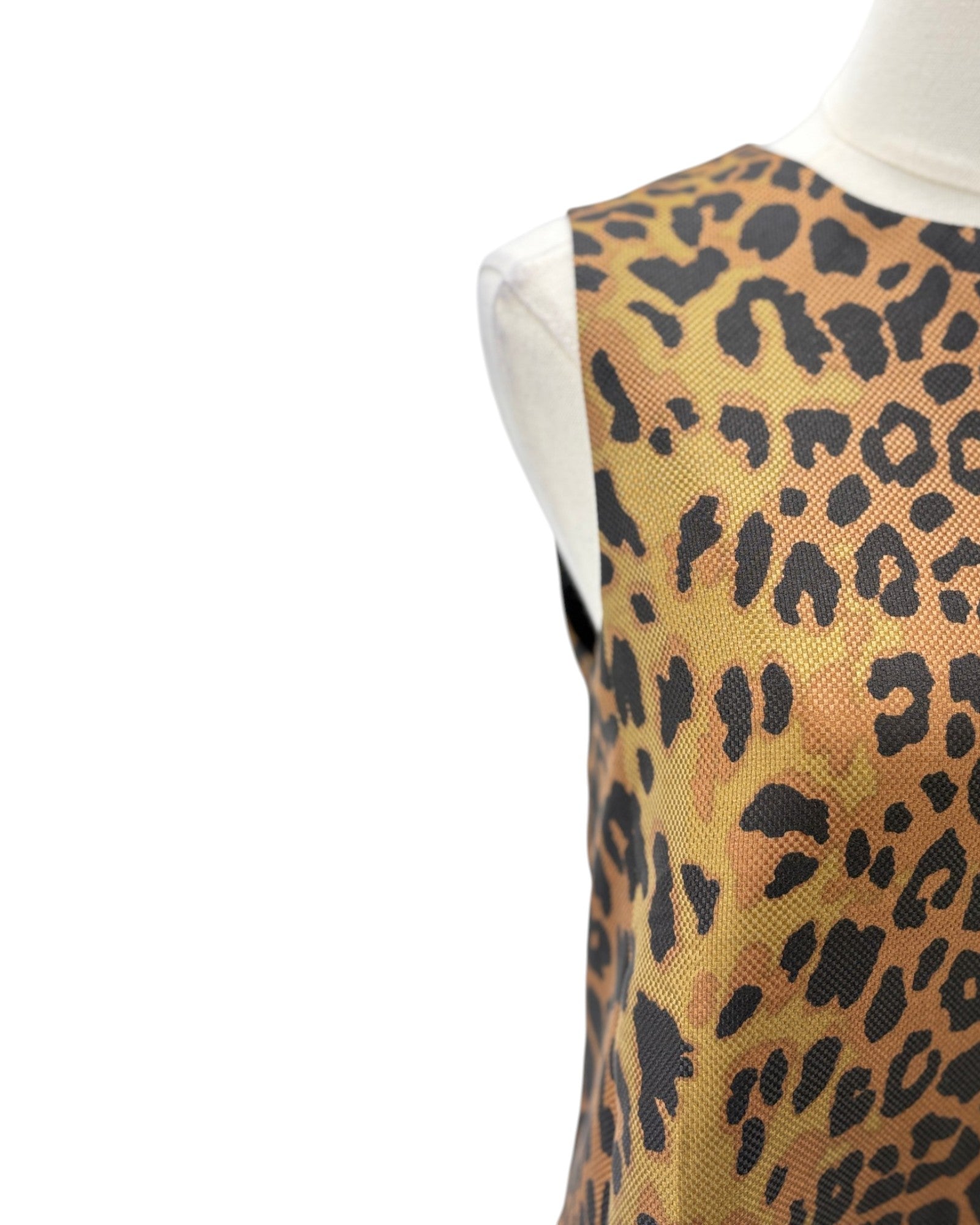 A sleeveless leopard print vest or top displayed on a white mannequin torso against a plain white background.