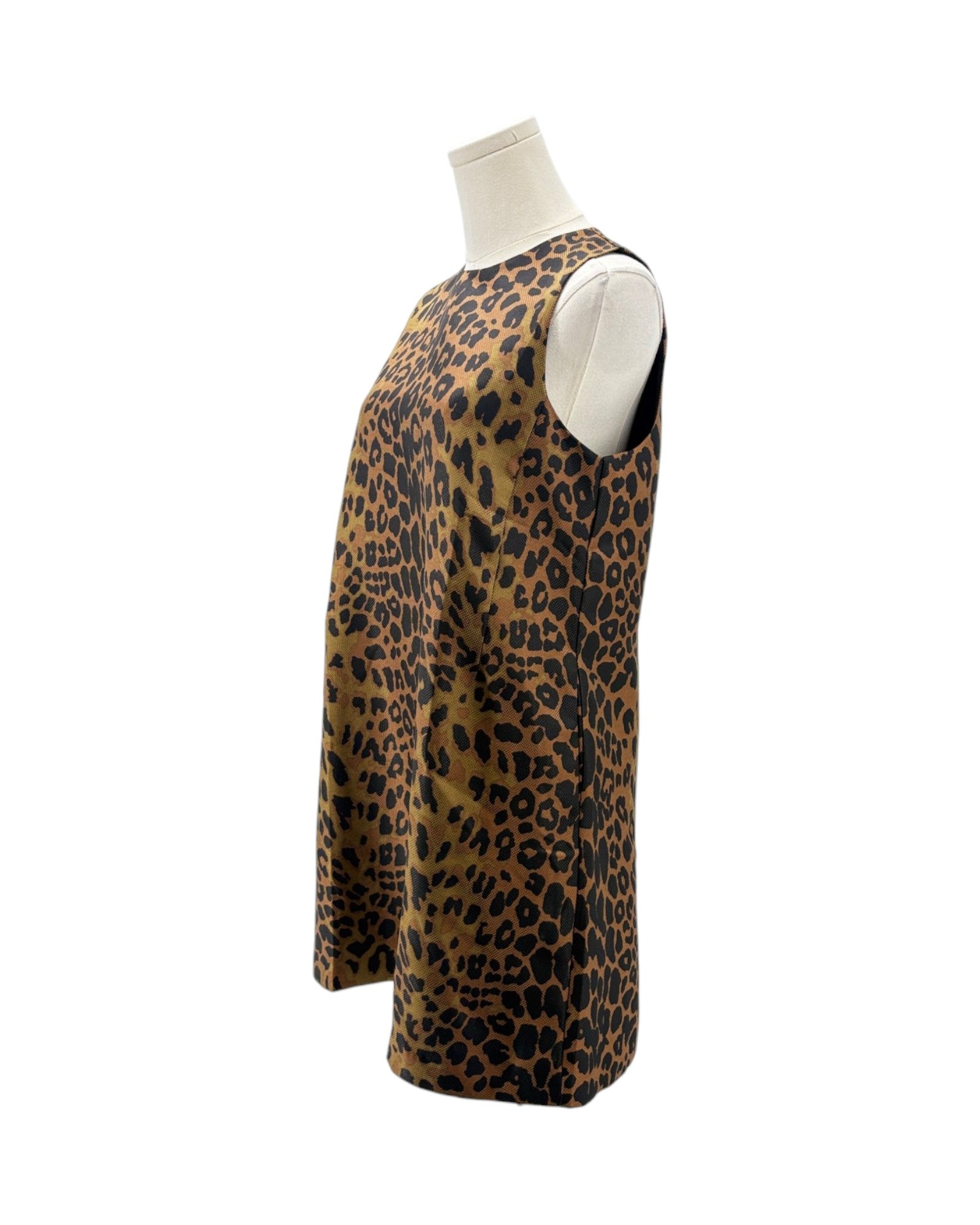 A sleeveless leopard print top displayed on a mannequin torso against a plain white background.