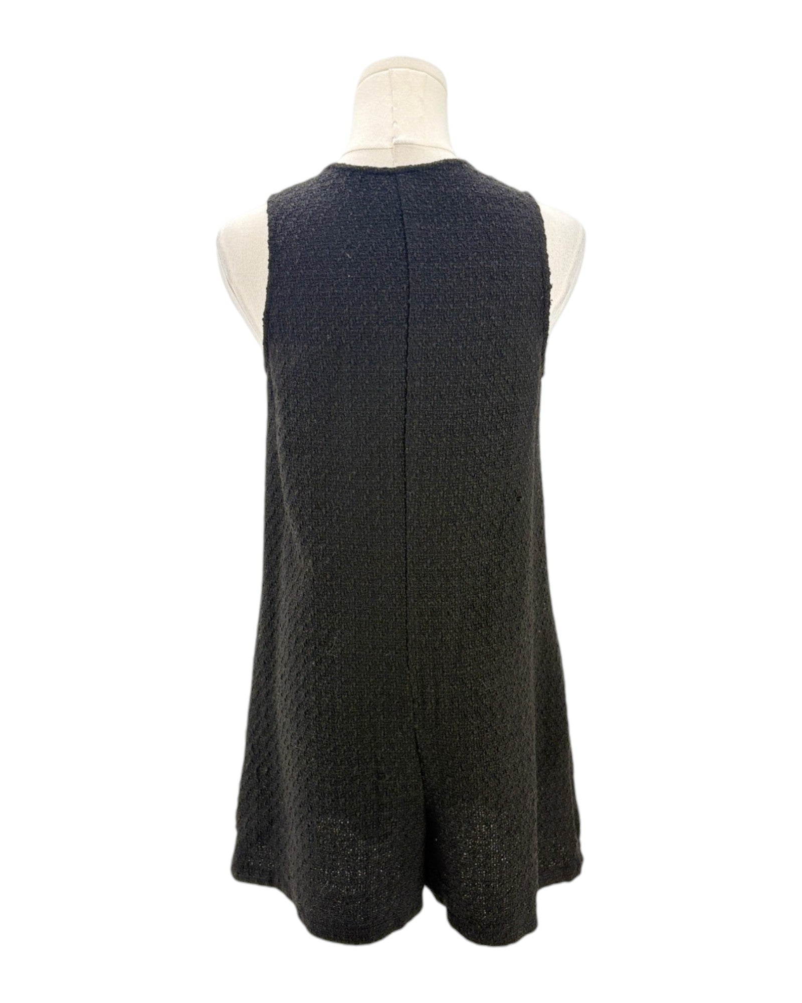Black sleeveless romper on a mannequin against a white background