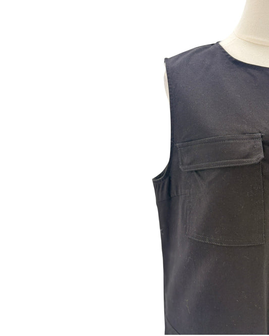 Black sleeveless mini dress on a mannequin on a white background