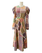 Multicolored patterned dress on a mannequin against a white background