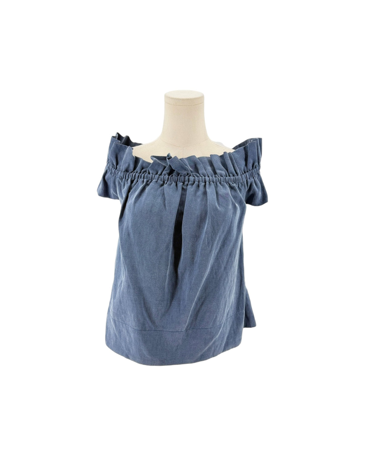 Blue off the shoulder top on a mannequin on a white background