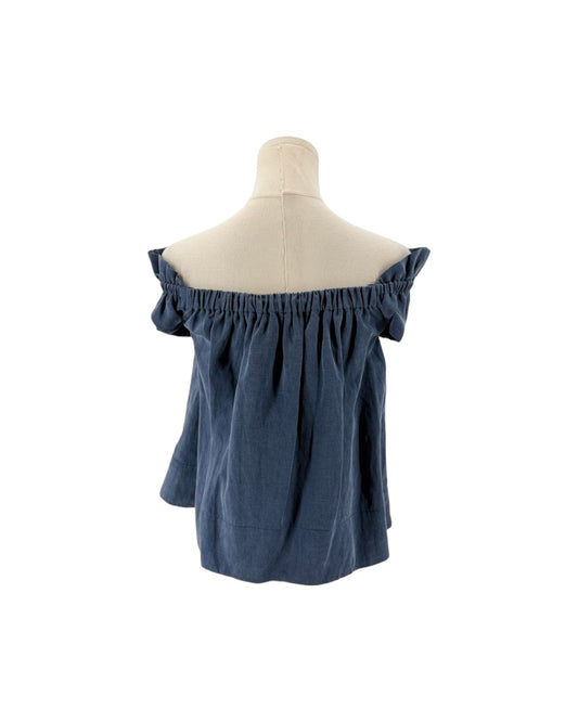 Blue off the shoulder top on a mannequin on a white background
