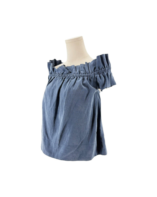 Blue off the shoulder top on a mannequin on a white background