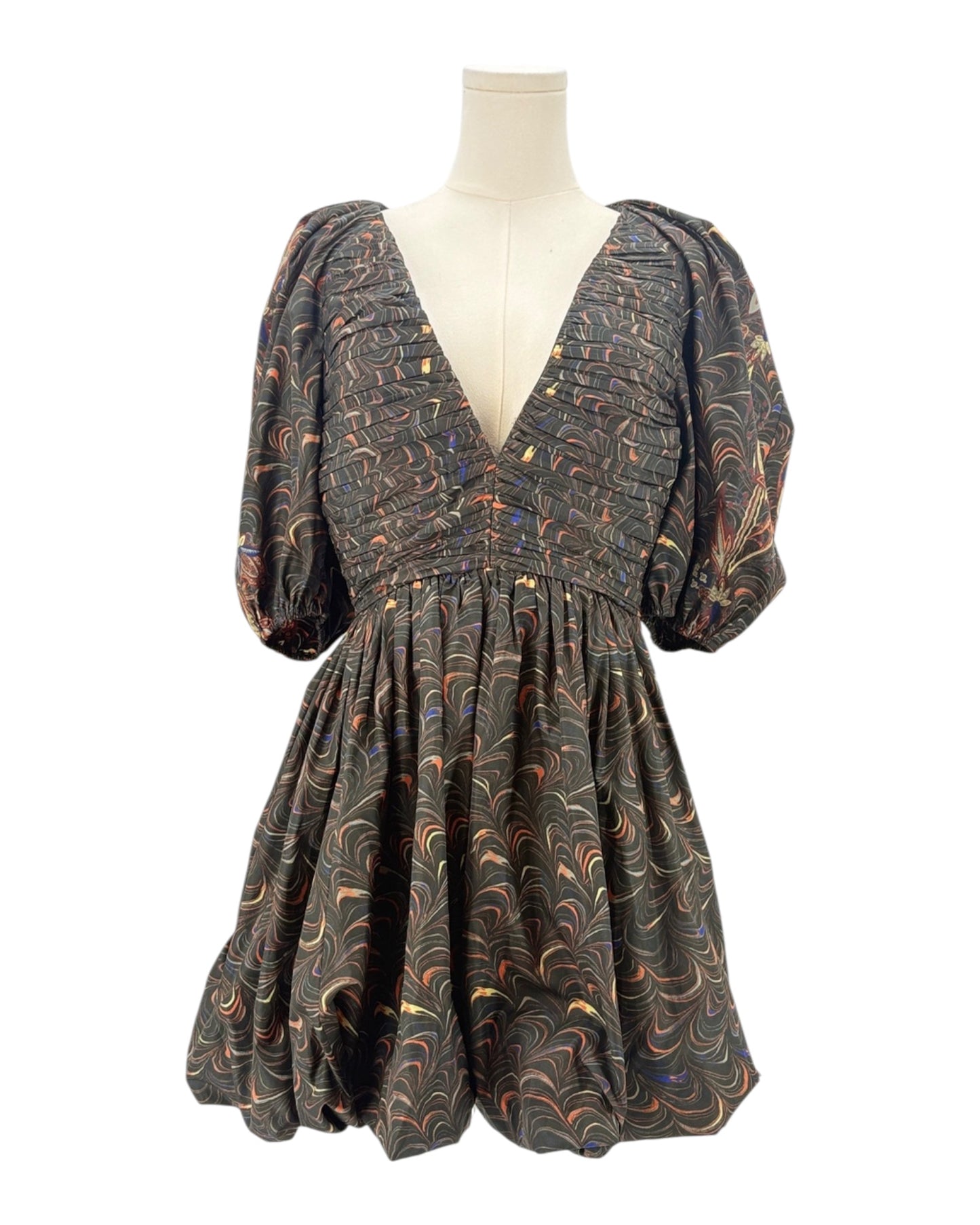 Patterned dress on a mannequin against a white background