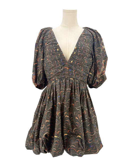 Patterned dress on a mannequin against a white background