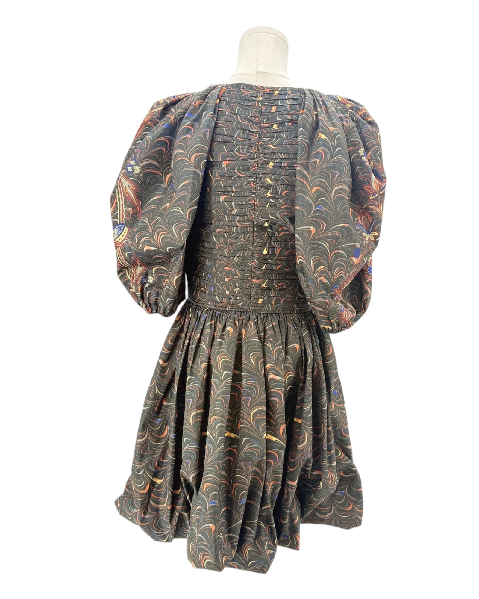 Patterned dress on a mannequin against a white background