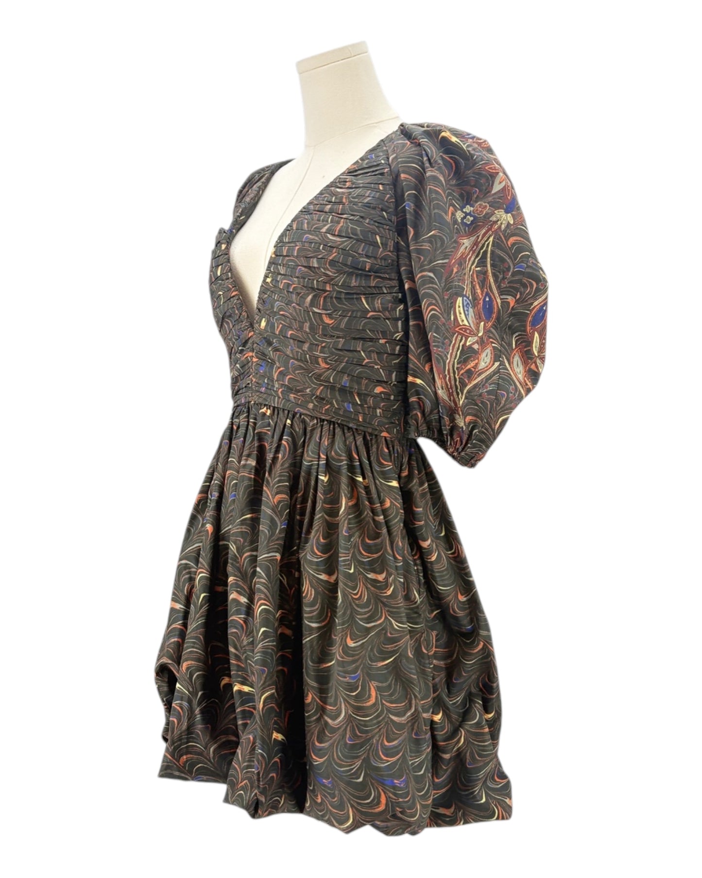 Patterned dress on a mannequin against a white background
