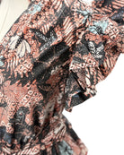 Close-up of a patterned fabric with butterfly design on a white background